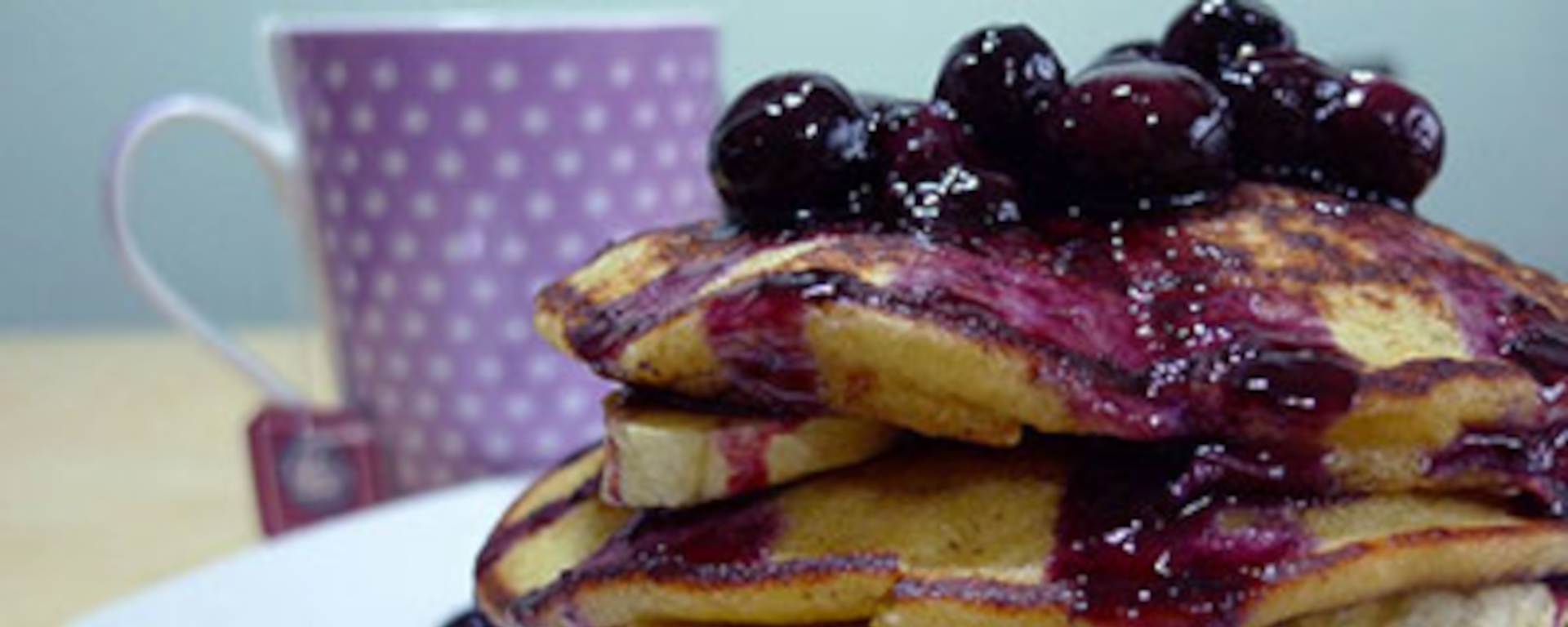 LuvMyRecipe.com - Banana Polenta Pancakes with Blueberry Sauce Featured